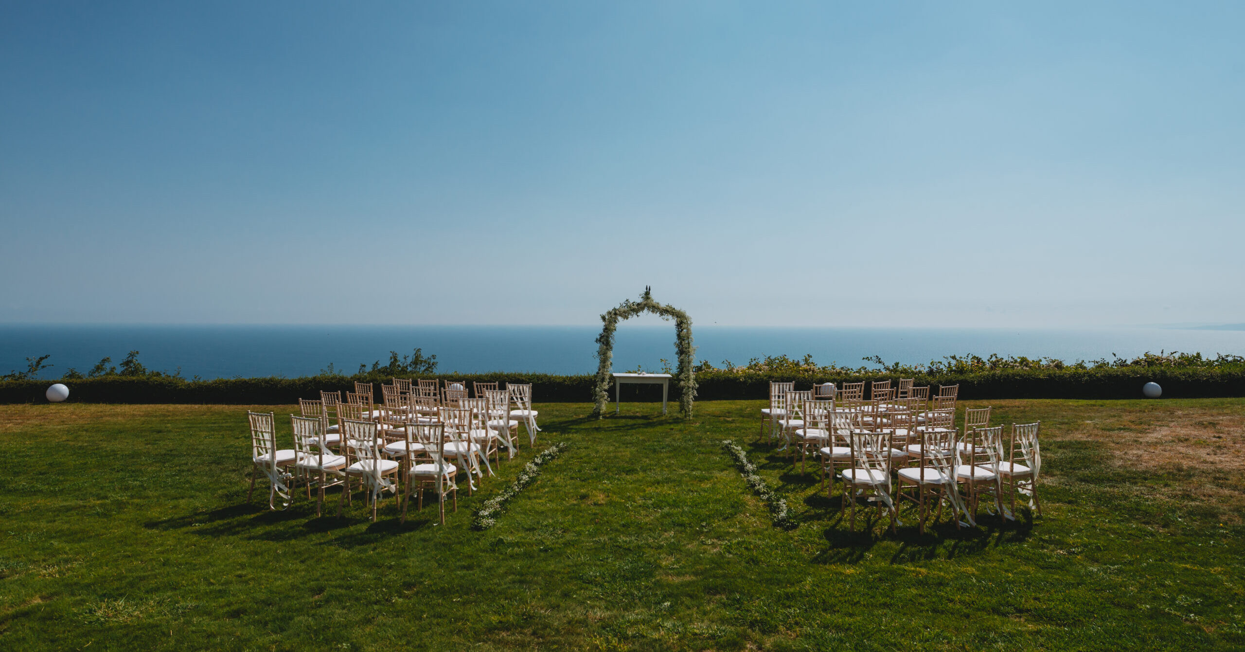 Outdoor wedding ceremony overlooking the Black Sea at BlackSeaRama Golf & Villas, Bulgaria